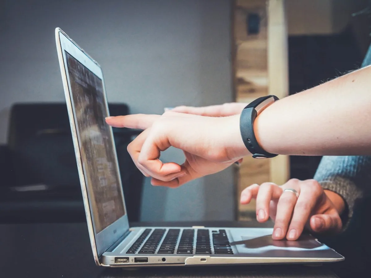 People working together at a laptop