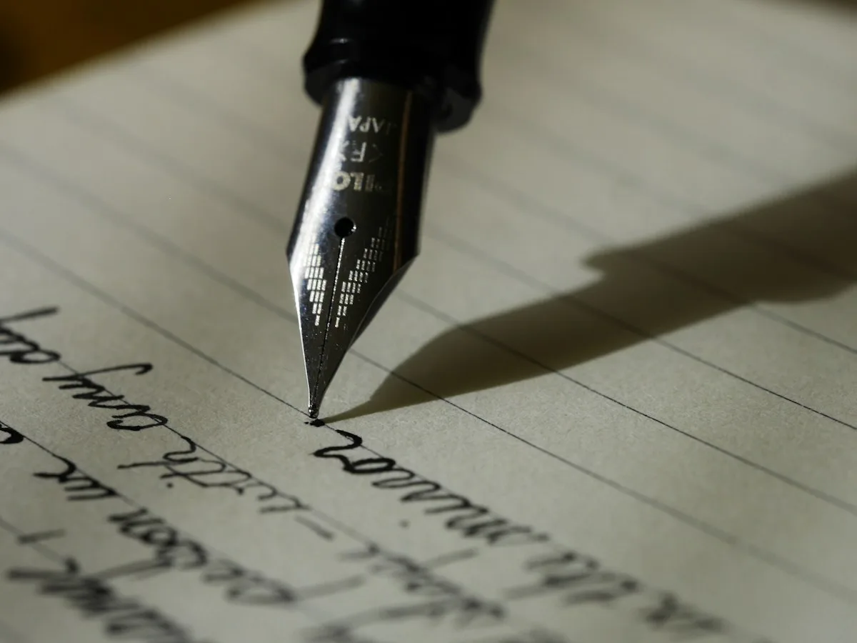 Notebook and writing materials on a working desk
